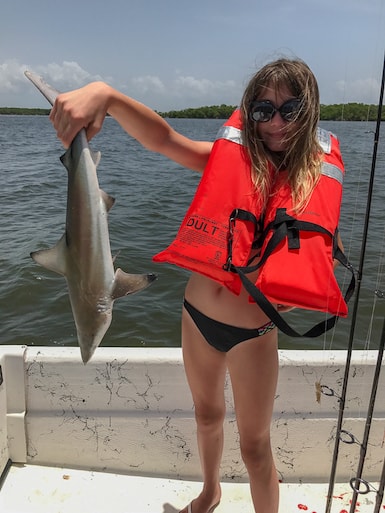 Woman Holding a Shark Near Marco Island